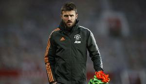 Michael Carrick merupakan mantan pemain sekaligus asisten Manajer di Mancherster United. Ia memulai kariernya setelah gantung sepatu pada 2018 silam. Kesuksesan Setan Merah menjadi runner up Liga Inggris dan Liga Europa merupakan salah satu jasanya. (Foto: AFP/Pool/Phil Noble)