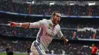 Selebrasi Gareth Bale usai mencetak gol kedua Real Madrid ke gawang Espanyol. (AP Photo/Francisco Seco)