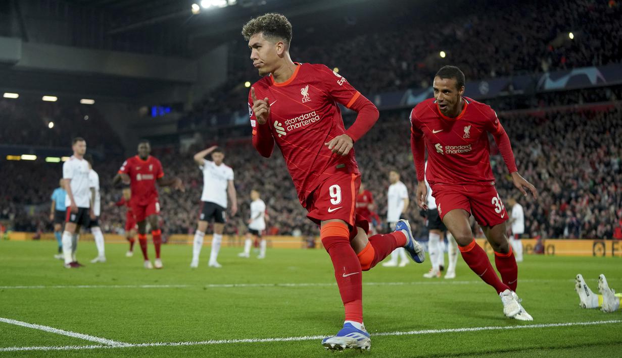 Liverpool. Roberto Firmino dkk baru saja memastikan penampilan ke-12 di semifinal Liga Champions usai menyingkirkan Benfica di perempatfinal musim 2021/2022. Dari 11 laga semifinal sebelumnya, The Reds sukses memenangkan 9 laga di antaranya. (AP/Jon Super)