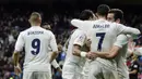 Bintang Real Madrid, Cristiano Ronaldo, merayakan gol yang dicetaknya ke gawang Sporting Gijon. Ronaldo mencetak gol pertamanya melalui titik putih pada menit kelima. (AFP/Javier Soriano)