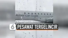 Pesawat American Airlines tergelincir saat mendarat di Bandara O'Hare, Chicago. Insiden ini terjadi  karena salju yang menutupi landas pacu.