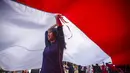 Warga berpartisipasi dalam pawai membawa bendera Indonesia sepanjang 500 meter di Jalan Sudirman Bogor, Jawa Barat, Minggu,  9 Agustus 2026. (AFP/ Aditya Aji)