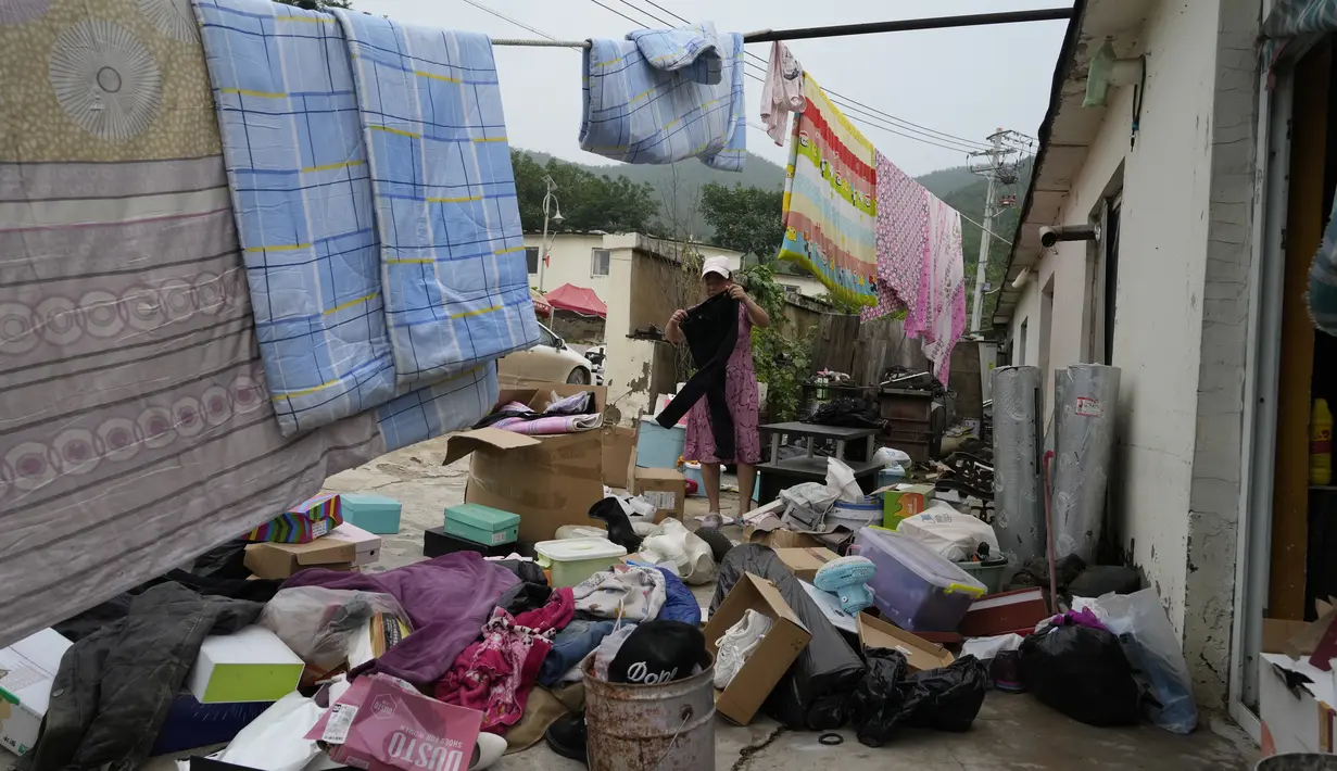Beijing biasanya mengalami musim panas yang kering, tetapi tahun ini mengalami musim panas yang basah. (AP Photo/Ng Han Guan)