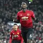 Gelandang Manchester United, Paul Pogba, melakukan selebrasi usai membobol gawang Brighton and Hove Albion  pada laga Premier League di Stadion Old Trafford, Sabtu (19/1). Manchester United menang 2-1 atas Brighton and Hove Albion. (AP/Martin Rickett)