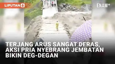 Aksi nekat ditunjukkan oleh seorang pria saat mendekati arus air yang deras mengundang perhatian