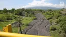 Suasana bekas jalur lahar letusan Gunung Agung 1963 di kawasan Kubu, Karangasem, Bali, Kamis (7/12). Letusan Gunung Agung pada tahun 1963 menyisakan berbagai material di kawasan tersebut, seperti batu dan pasir. (Liputan6.com/Immanuel Antonius)
