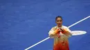 Atlet Wushu Indonesia, Alisya Mellynar saat bertanding dalam cabang olahraga Wushu nomor Taolu Tajiquan Wanita SEA Games 2021 yang berlangsung di Cau Giay Gymnasium, Hanoi, Sabtu (14/5/2022). Ia berhasil meraih medali emas setelah mengumpulkan skor 9,71. (Bola.com/Ikhwan Yanuar)