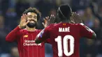 Penyerang Liverpool, Mohamed Salah bersama Sadio Mane merayakan gol ke gawang KRC Genk pada laga Liga Champions 2019 di KRC Genk Arena, Rabu (23/10). Liverpool menang 4-1 atas KRC Genk. (AP/Francisco Seco)