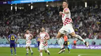 Pemain Kroasia,&nbsp;Ivan Perisic merayakan gol penyeimbang 1-1 ke gawan Jepang saat laga 16 besar Piala Dunia 2022 yang berlangsung di Al Janoub Stadium, Senin (05/12/2022). (AP/Thanassis Stavrakis)