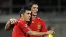 Ekspresi kegembiraan David Villa (kiri) dan Fernando Torres ketika Spanyol melumat Liechtenstein 4-0 pada partai kualifikasi Euro 2012 di Vaduz, 3 September 2010. AFP PHOTO/FABRICE COFFRINI