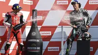 Dua pembalap akademi VR46: Pecco Bagnaia dan Franco Morbidelli naik podium MotoGP San Marino, Minggu (13/9/2020). (ANDREAS SOLARO / AFP)