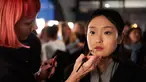 Seorang model saat dirias di belakang panggung sebelum berjalan di atas catwalk membawakan busana asal Inggris Temperley London pada Autumn / Winter 2017 London Fashion Week di London, Inggris (19/2).  (AFP Photo / Niklas Halle'n) 