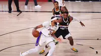 Duel Denver Nuggets melawan LA Lakers pada gim ketiga final NBA Wilayah Barat di AdventHealth Arena at the ESPN Wide World Of Sports Complex, Rabu (23/9/2020) pagi WIB. (Mike Ehrmann / Getty Images via AFP)