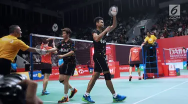 Ganda campuran Indonesia, Tontowi Ahmad/Liliyana Natsir usai melawan Lee Yang/Hsu Ya Ching (Taiwan) pada babak kedua Indonesia Masters 2018 di Istora Senayan, Jakarta, Kamis (25/1). Tontowi/Liliyana unggul 21-12, 21-10. (Liputan6.com/Helmi Fithriansyah)