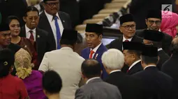 Presiden Joko Widodo atau Jokowi (tengah) menghadiri sidang Tahunan MPR Tahun 2019 di Kompleks Parlemen, Senayan, Jakarta, Jumat (16/7/2019). Sidang tersebut beragendakan penyampaian pidato kenegaraan Presiden Jokowi dalam rangka HUT Ke-74 Kemerdekaan Republik Indonesia. (Liputan6.com/Johan Tallo)