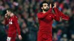 Gelandang Liverpool, Mohamed Salah berselebrasi usai timnya memenangkan pertandingan melawan Napoli pada matchday keenam Grup C Liga Champions di Stadion Anfield, Selasa (11/12). Gol Salah mengantarkan Liverpool mengalahkan Napoli 1-0. (AP/Dave Thompson)