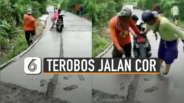 Ia nekat menerobos jalan yang tengah dicor dan masih basah.