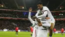Gelandang Paris Saint-Germain (PSG) Danilo Pereira (tengah) bersama rekan setimnya merayakan gol ke gawang Lille dalam lanjutan Liga Prancis di Stadion Pierre-Mauroy, Senin (7/2/2022) dinihari WIB. PSG mengalahkan juara bertahan Lille dengan skor 5-1. (AP Photo/Michel Spingler)