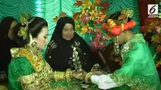 Sebuah rekaman menunjukkan pesta pernikahan pasangan di bawah umur yang terjadi di Sulawesi Barat.