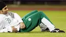 Saudia Arabia's Yasser al-Qahtani lies on the field during a training session in the Omani capital Muscat on January 16, 2009. Saudi Arabia faces Oman tomorrow in the 19th Gulf Cup final. AFP PHOTO/KARIM JAAFAR 