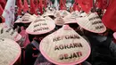Para petani menyuarakan sejumlah tuntutan terkait reforma agraria yang dinilai belum berpihak pada masyarakat kecil. (Yasuyoshi CHIBA/AFP)