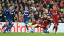 Gelandang Liverpool, Xherdan Shaqiri saat dilanggar pemain Red Star Belgrade, Marko Marin selama pertandingan grup C Liga Champions di stadion Anfield, Inggris (24/10). Liverpool menang telak 4-0 atas Red Star. (AP Photo/Jon Super)