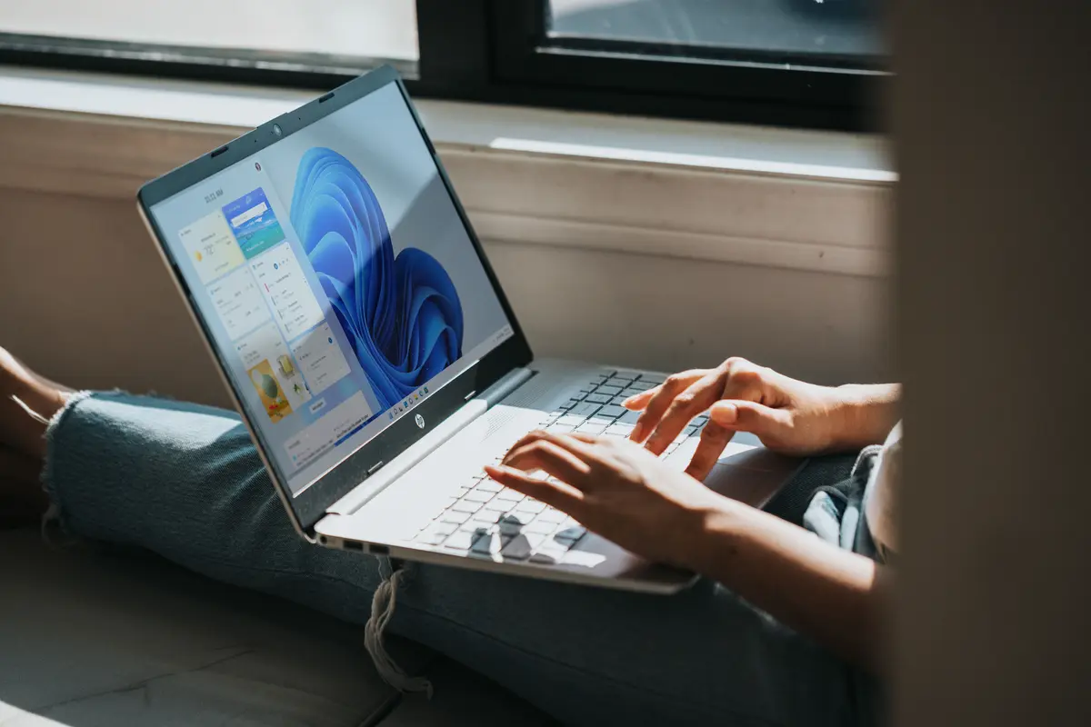 Person working on Windows 11 computer