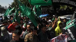 Para pendemo meminta kepada majelis hakim agar membebaskan Anas Urbaningrum dari segala tuntutan, Jakarta, (24/9/14). (Liputan6.com/Miftahul Hayat) 
