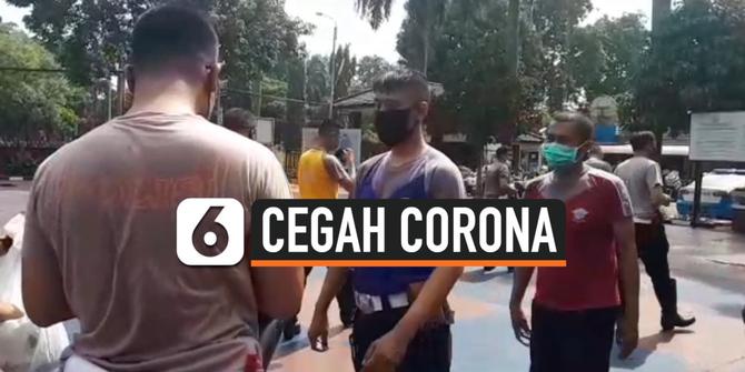 VIDEO: Begini Cara Anggota Polisi Mencegah Corona