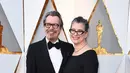 Gary Oldman dan Gisele Schmidt saat tiba dalam acara Oscar 2018 di Dolby Theater, Los Angeles, Amerika Serikat, Minggu (4/3). (Jordan Strauss/Invision AP)