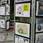 Sejumlah karya komik dan ilustrasi antikorupsi digelar dalam pameran bertajuk AKU KPK ( Aksi Komik Untuk KPK) di Gedung KPK, Jakarta, Rabu (23/8). Pameran tersebut didukung oleh Persatuan Kartunis Indonesia (Pakarti). (Liputan6.com/Helmi Afandi)