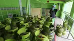 Karyawan menyemprotkan cairan disinfektan ke tabung gas ukuran 3 kg di Agen LPG 3 kg, Bojongsari, Depok, Senin (4/5/2020). Penyemprotan dilakukan sebelum dikirim ke pengecer di daerah sekitar sebagai upaya pencegahan penyebaran Covid-19. (Liputan6.com/Fery Pradolo)