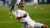 Penyerang Real Madrid, Angel Di Maria, merayakan golnya saat berlaga melawan Almeria dalam laga lanjutan La Liga Spanyol di stadion Santiago Bernabeu, Madrid, (13/4/2014). (REUTERS/Susana Vera)