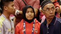 Atlet Judo Indonesia, Miftahul Jannah, tampak sedih usai gagal berlaga pada Asian Para Games di Jiexpo, Kemayoran, Jakarta, Senin (8/10/2018). Miftah didiskualifikasi karena enggan melepas hijab nya. (Bola.com/M Iqbal Ichsan)