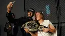 Ronda Rousey saat hadir dalam salah satu acara UFC dan Reebok. (Brad Barket/Getty Images for Reebok/AFP)