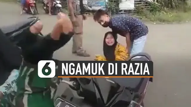 Video seorang pengendara motor perempuan mengamuk di jalan saat di razia petugas polisi karena tidak memakai masker dan helm.