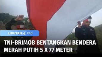 VIDEO: TNI dan Brimob Bentangkan Bendera Merah Putih Berukuran 5 x 77 Meter di Gunung Lanyer