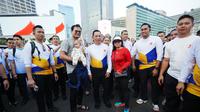 Kapolri Jenderal Listyo Sigit Prabowo mengikuti kegiatan Car Free Day (CFD) di Bundaran Hotel Indonesia (HI), Jakarta, Minggu pagi (22/6/2025). (Liputan6.com/Nanda Perdan Putra)