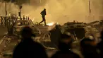 Seorang demonstran berlarian pada malam ketiga protes yang dipicu oleh penembakan fatal polisi terhadap seorang pengemudi berusia 17 tahun di Nanterre, Prancis, Jumat (30/6/2023). (AP Photo/Aurelien Morissard)