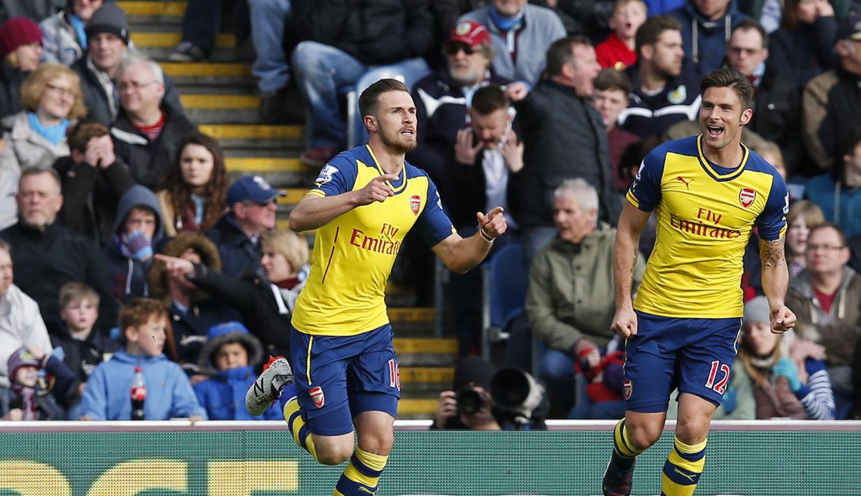 Aaron Ramsey melakukan selebrasi gol. Ia telah tampil 150 kali bagi Arsenal