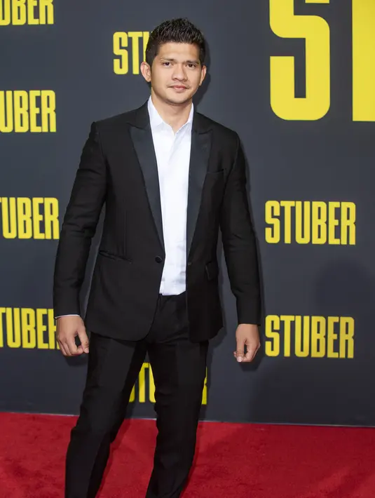 Aktor Iko Uwais berpose di karpet merah saat menghadiri pemutaran perdana "Stuber" di Regal Cinemas LA Live di Los Angeles (10/7/2019). Film komedi aksi Amerika 2019 dengan peringkat "R" oleh Walt Disney Studios Motion Pictures. (AFP Photo/Nick Agro)