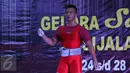 Lifter Lampung, Viky Aryanto usai mengangkat beban seberat 291kg di kelas 66 kg putra PON XIX di GOR Sabilulungan, Kab Bandung, Minggu (25/9). Viky merebut emas di kelas 66 kg dengan total angkatan 798 kg. (Liputan6.com/Helmi Fithriansyah)