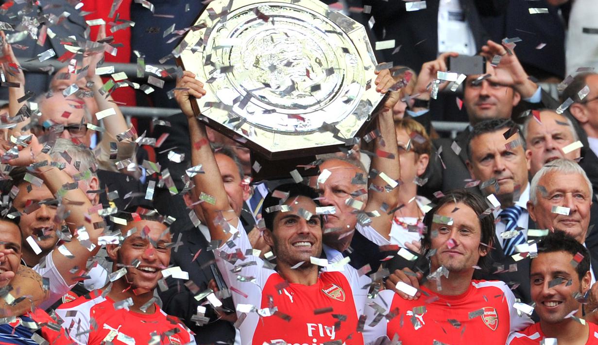 Mikel Arteta sukses bersama Manchester City sebagai asisten pelatih dengan meraih trofi Premier League. Arteta bermain untuk Arsenal pada 2011 hingga 2016. (AFP/Glyn Kirk)