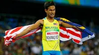 Sprinter Malaysia, Mohamad Ridzuan Mohamad Puzi, berselebrasi setelah merebut medali emas di nomor lari 100 meter T36 (celebral palsy) di Paralimpiade Rio 2016, Minggu (11/9/2016). (Reuters) 