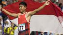 Purnomo Sapto Yogo pelari Indonesia meraih medali emas di nomor 100 meter putra klasifikasi T37 pada Asian Para Games 2018, di Stadion Utama Gelora Bung Karno Jakarta, Selasa (9/10/2018).  (Bola.com/Peksi Cahyo)