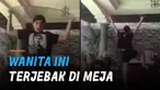 Entah apa motivasinya, ia berjalan dan masuk ke meja tamu.
