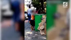 Karena kelaparan, seorang bocah makan dan minum sisa makanan yang ada di tempat sampah.