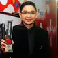 Vokalis Ungu, Pasha meraih penghargaan Most Gorgeous Dad di ajang Infotainment Award 2014 (Liputan6.com/Rini Suhartini)