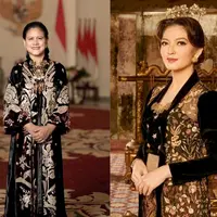Kebaya panjang velvet warna hitam yang dihiasi bordiran emas membuat penampilan Ibu Negara Iriana Jokowi semakin elegan nan mewah. Apalagi ditambah aksesori yang disematkan di dada. [@doleytobing]