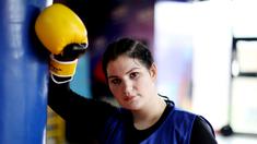 Petinju wanita Albania, Elsidita Selaj, berpose usai melakukan sesi latihan di Shkodra, Kamis (21/1/2021). Tekad yang kuat membuat wanita berusia 20 tahun ini menjadi petinju wanita pertama di Albania. (AFP/Gent Shkullaku)